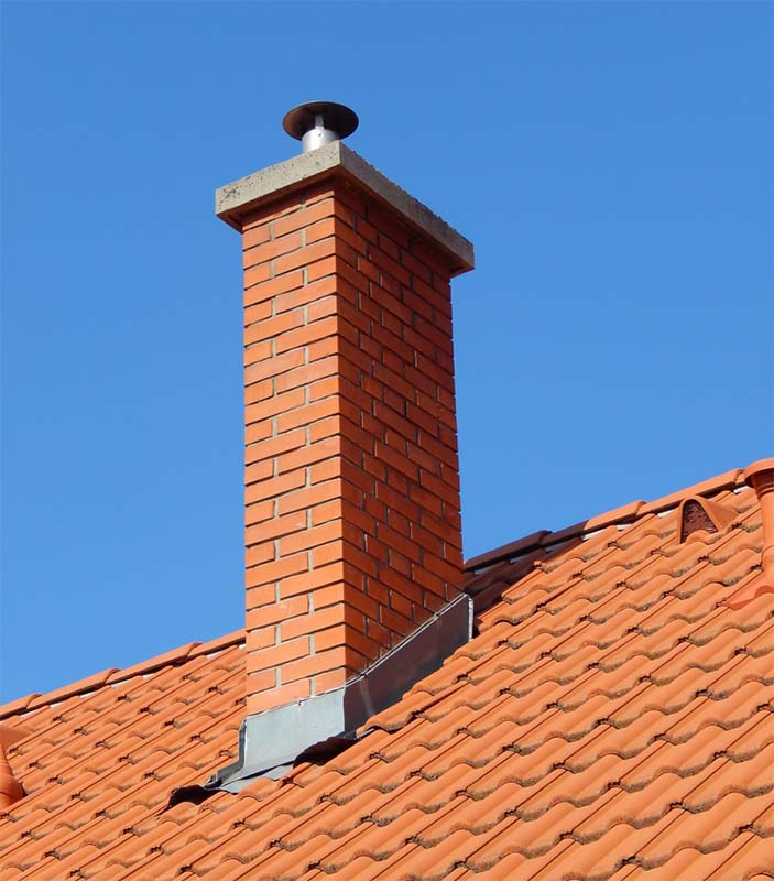 red brick chimney with metal flashing